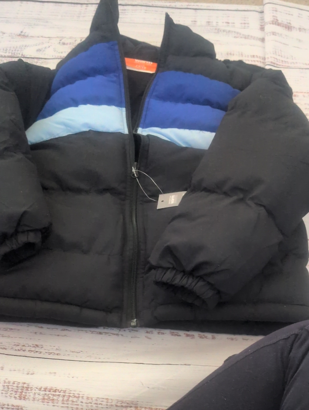 Warm Black Puffer Jacket with Blue Chevron Panels